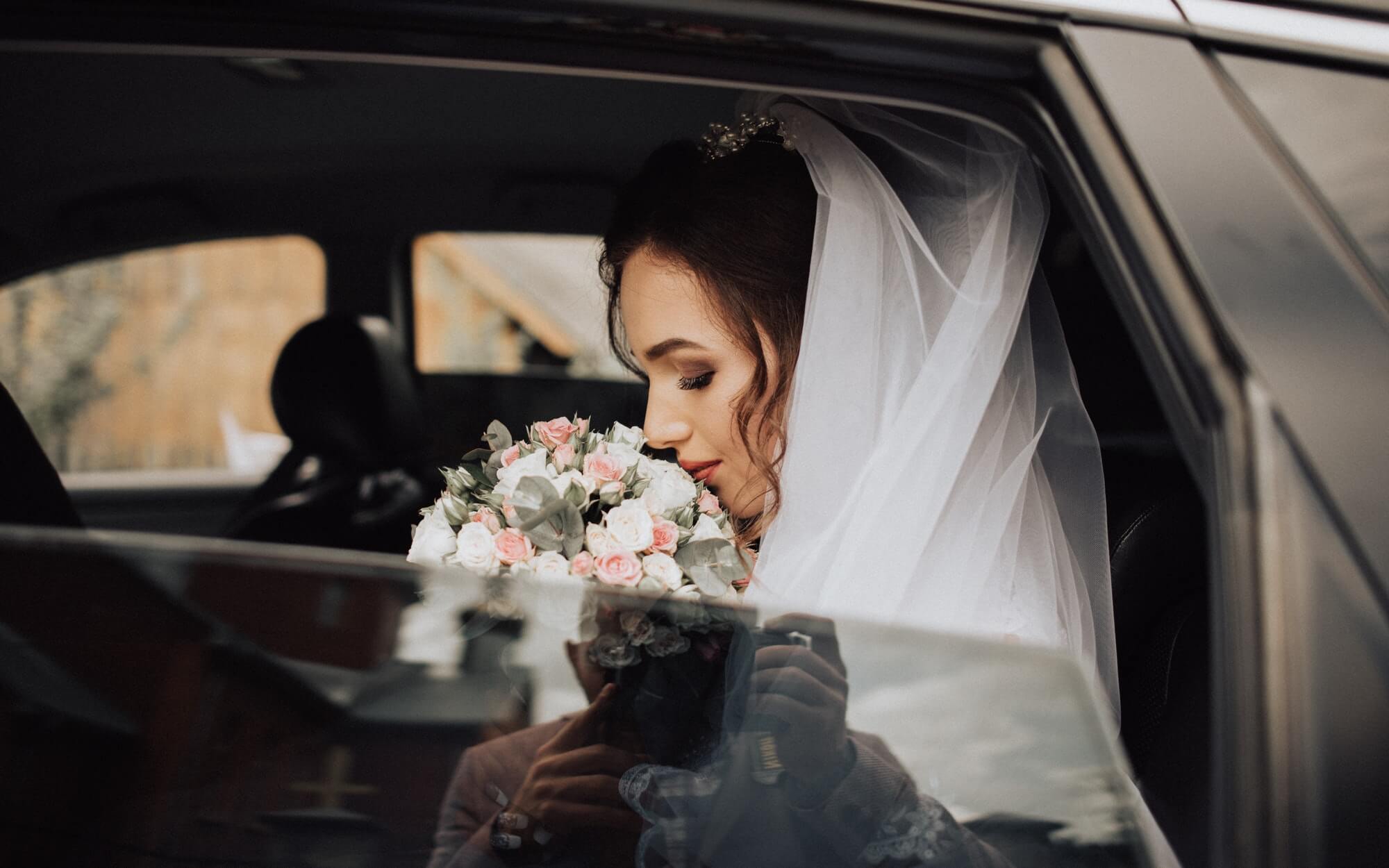 photography of the bride in the car