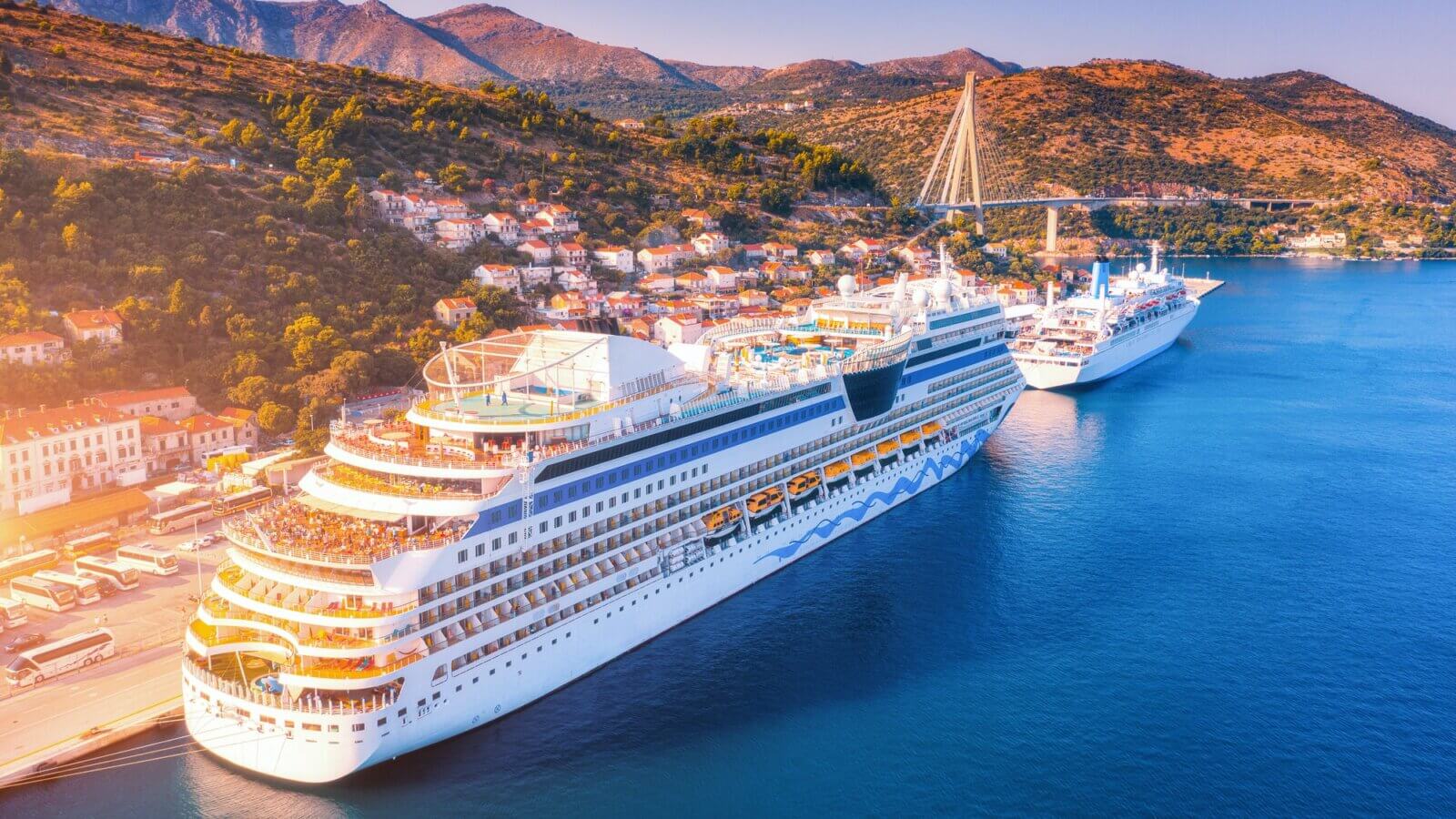 Aerial view of beautiful large white cruise ships at sunset