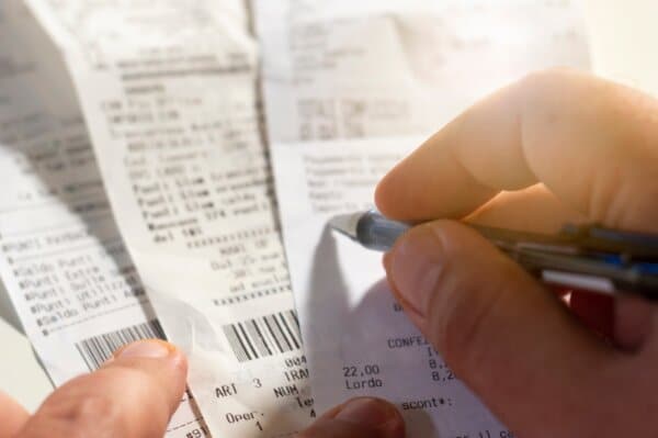 checking a receipt by analyzing the numbers, expenses and profits