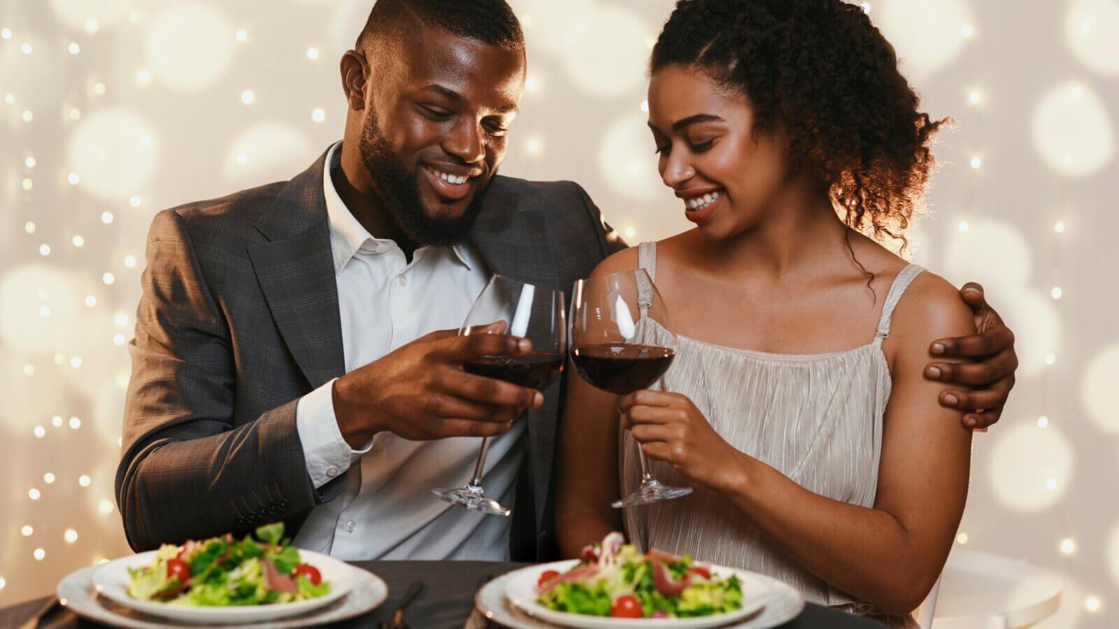 Married black couple celebrating anniversary in fancy restaurant