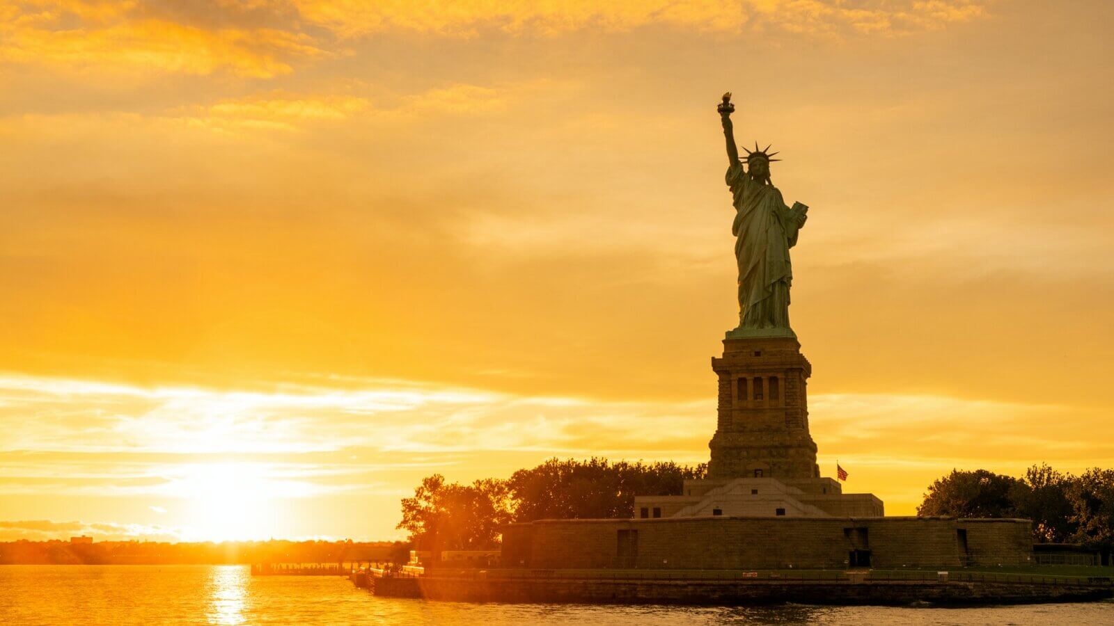 The Statue of Liberty at New York city during sunset