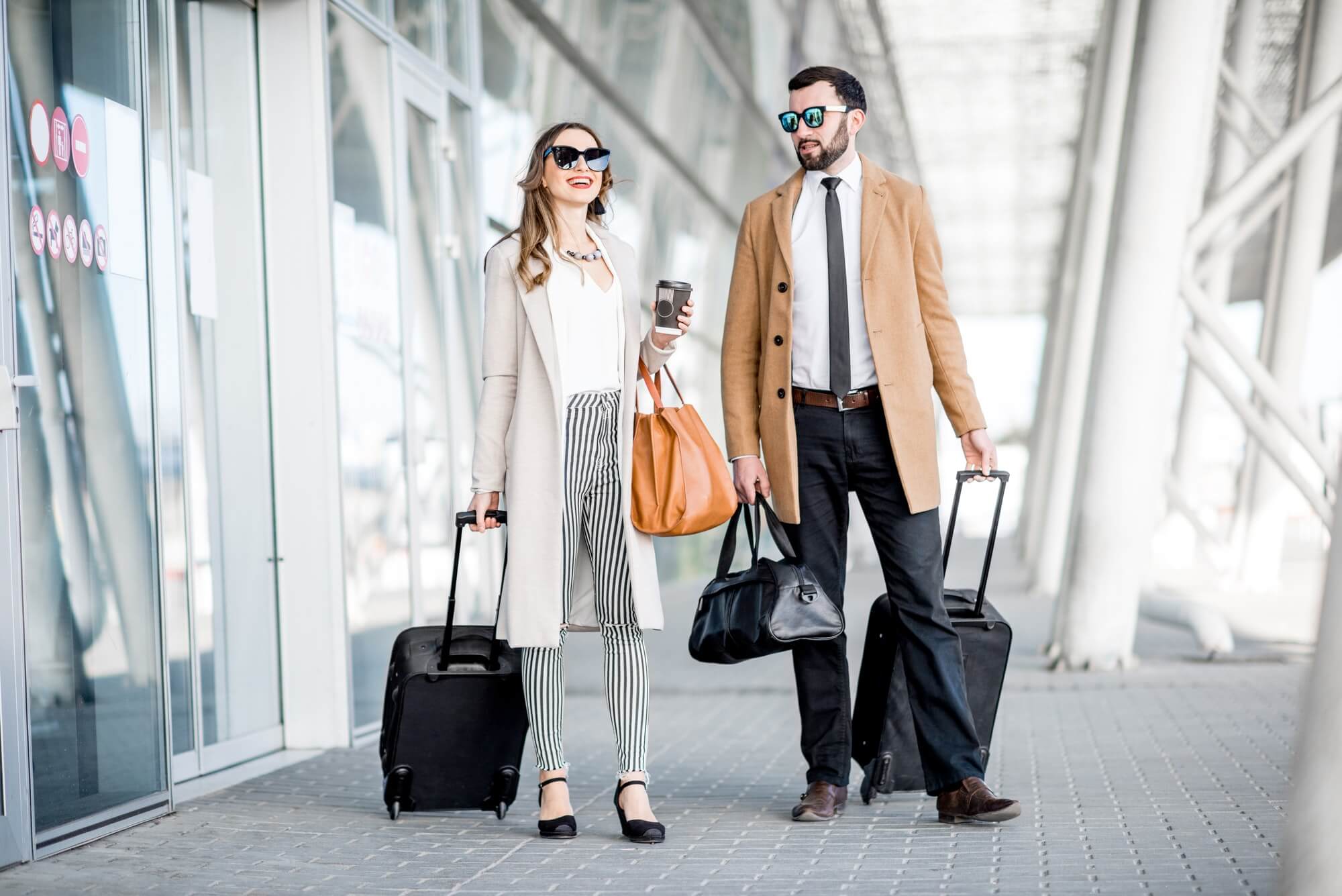 Business couple leaving the airport