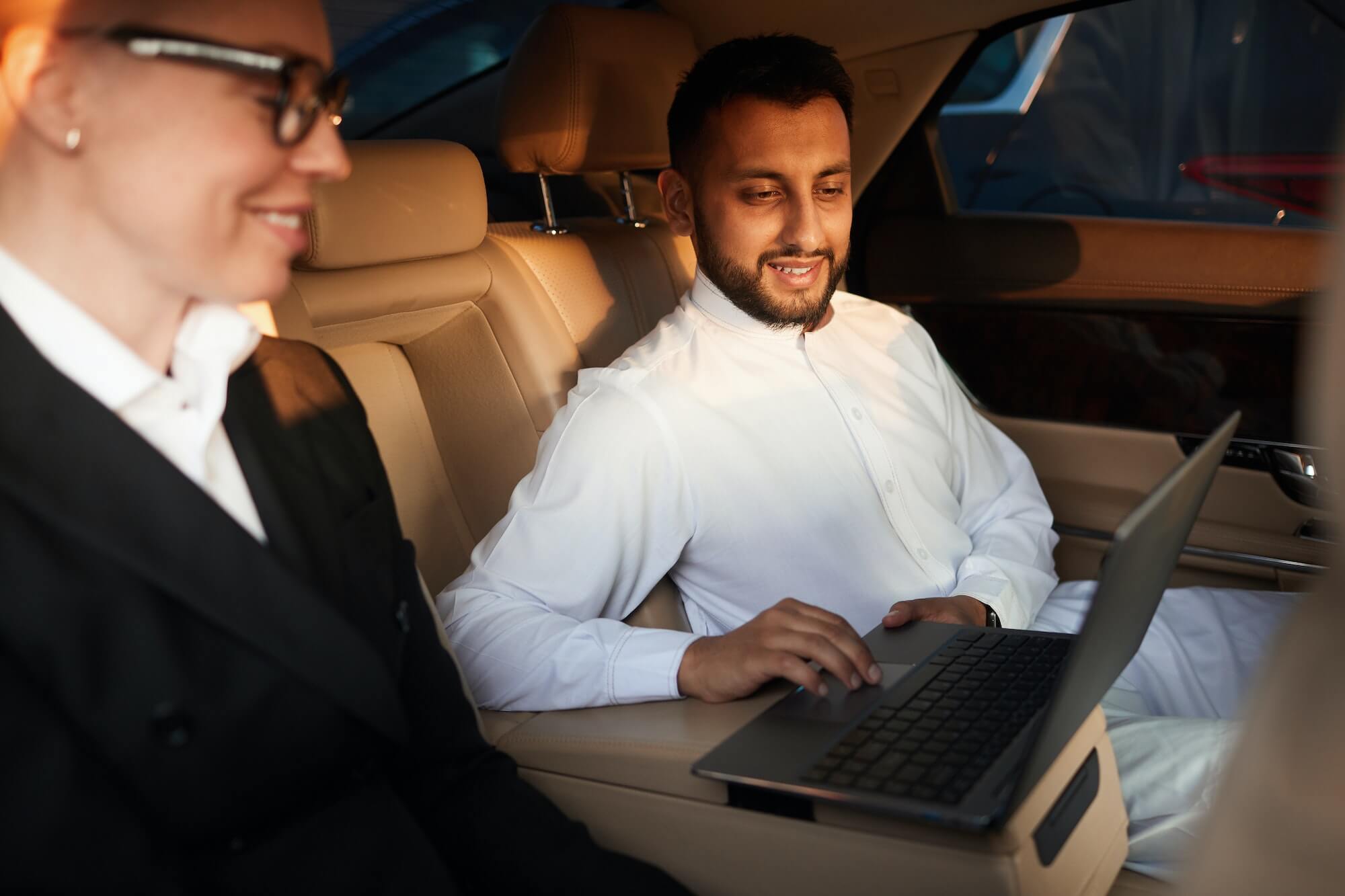 Business people working in the car