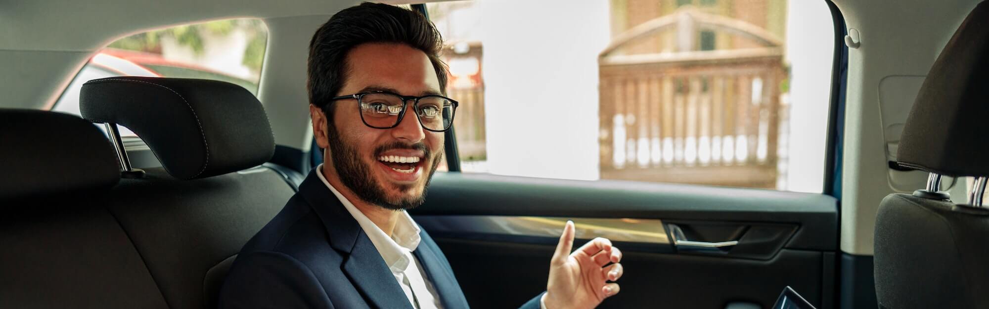 Businessman have a business meeting via video call while riding in car to office