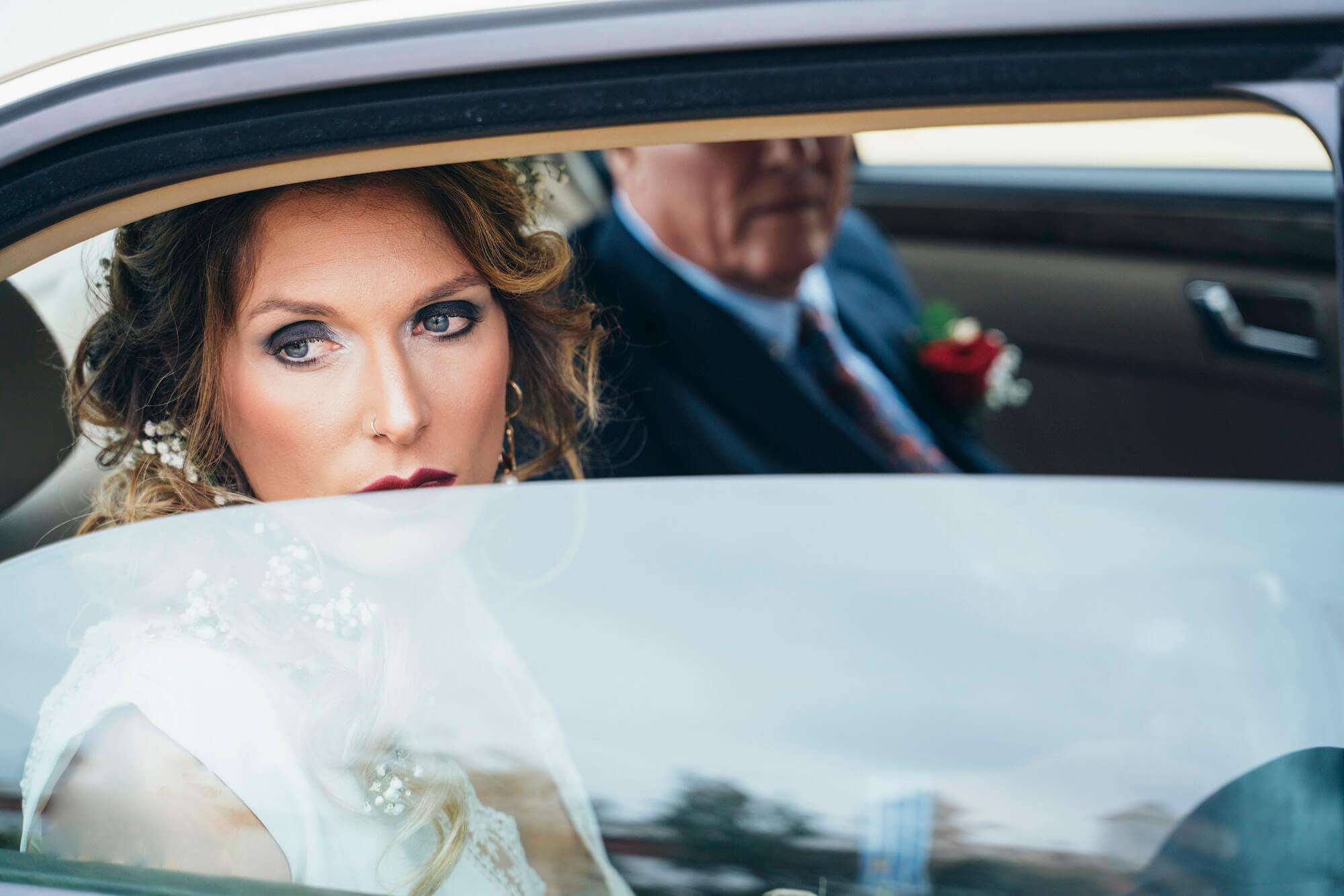 the bride arriving to the wedding by car.