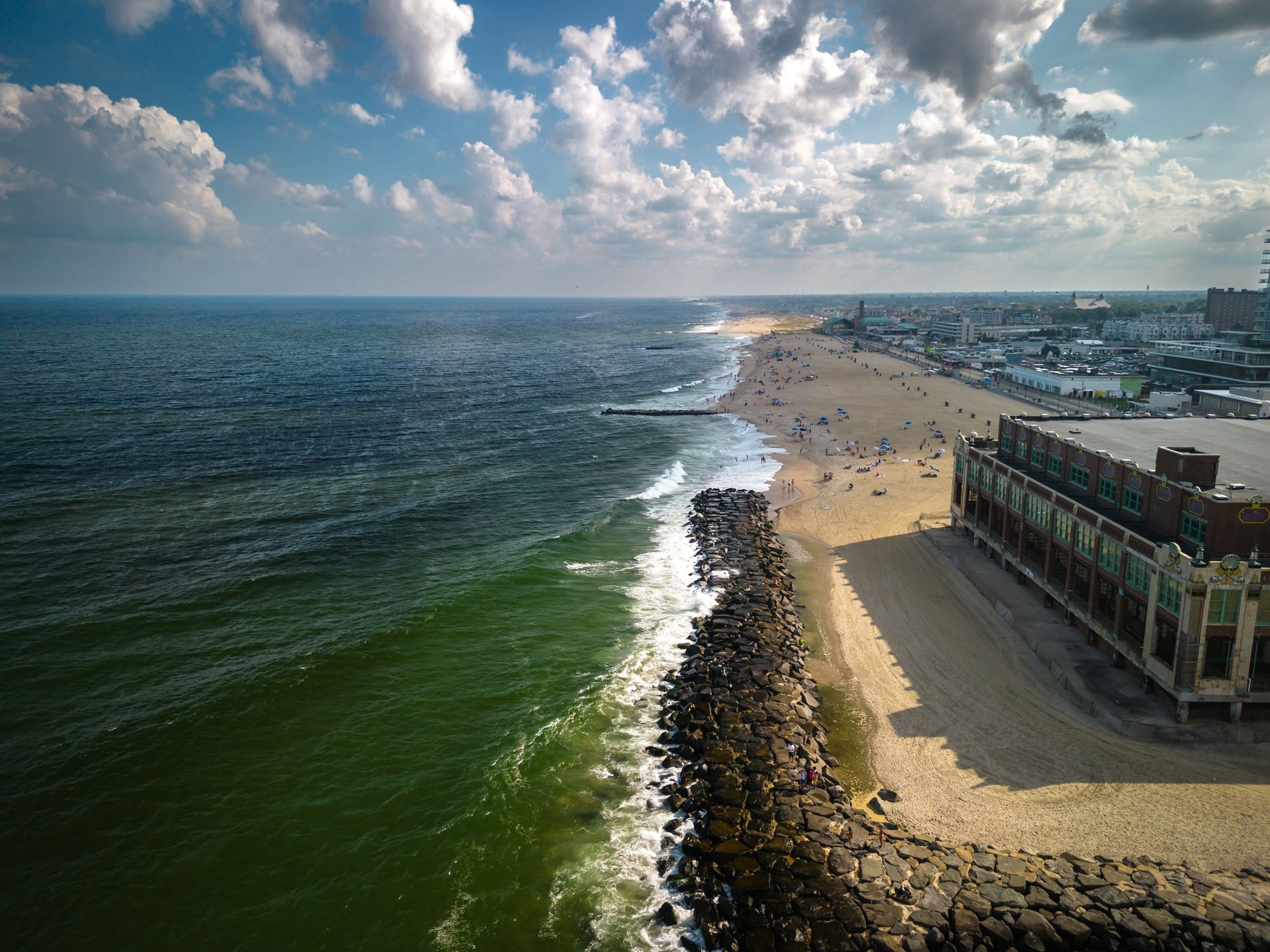 Drone of a building in Asbury Park Beach Boardwalk New Jersey by the Atlantic Ocean