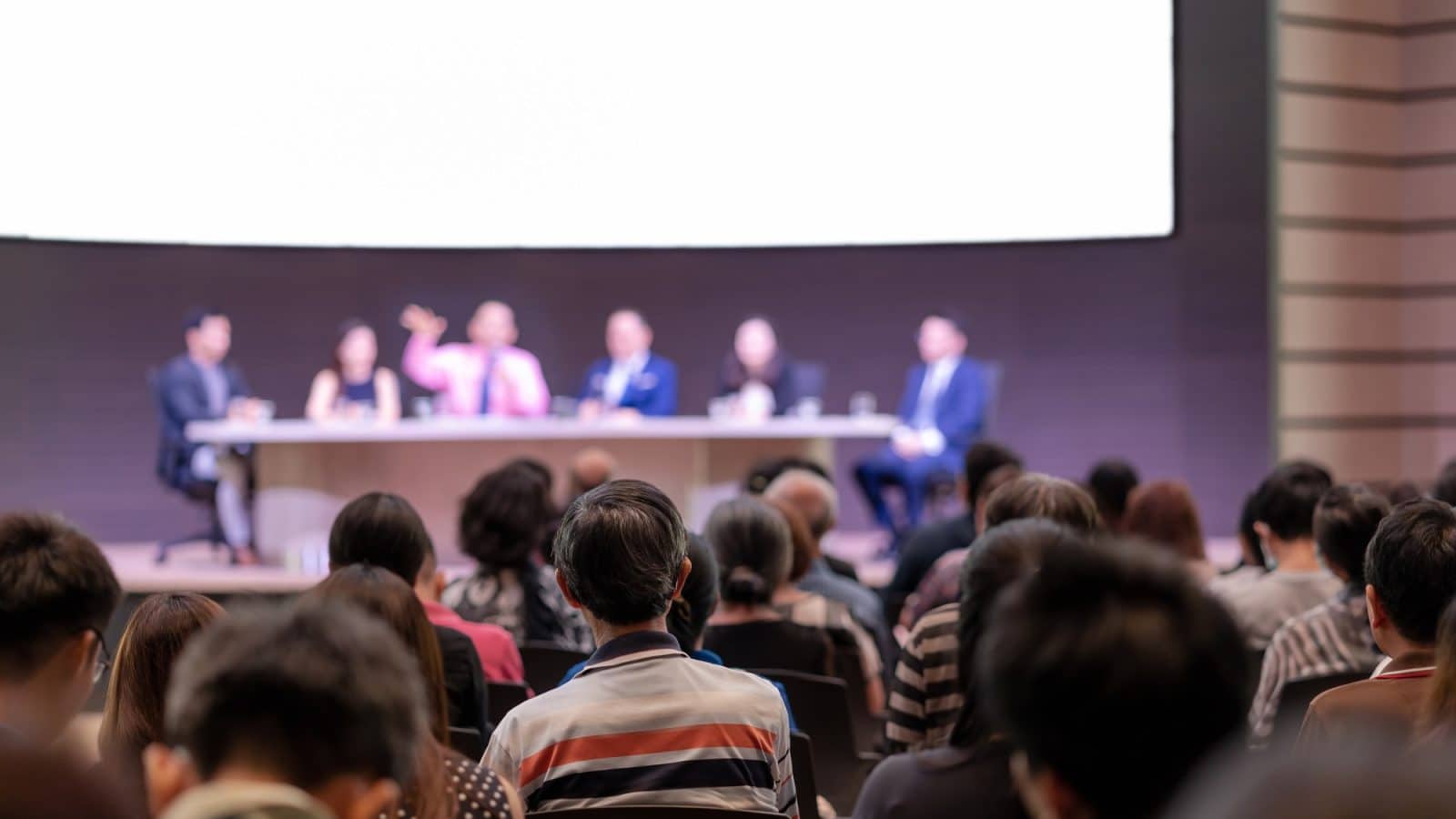 Rear view of Audience in the conference hall or seminar meeting